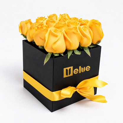 Rosas amarillas en caja negra con lazo amarillo, vista lateral. Velve Floristería, Paseo de las Flores, Heredia.